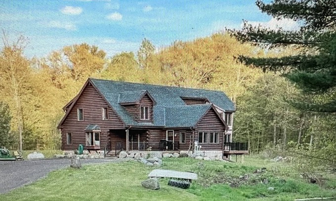 Amery Cabina | 6000 sqft Log Cabin - Nestled on 53 acres -ski out access. 10 min from the lake!