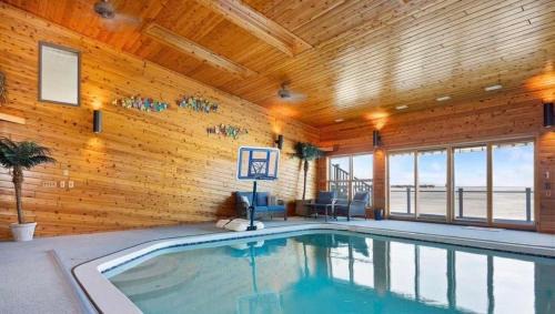 Prudenville Casa | 6BR Houghton Lake House with Indoor Pool, Hot Tub and Golf Simulator