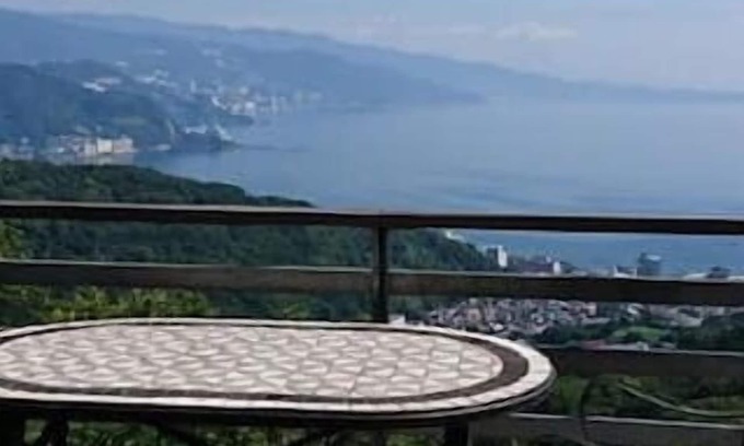 Shimotaga Casa | A spectacular view! Relax on the sea-view terrace / Scandinavian log house with hot spring & fireplace