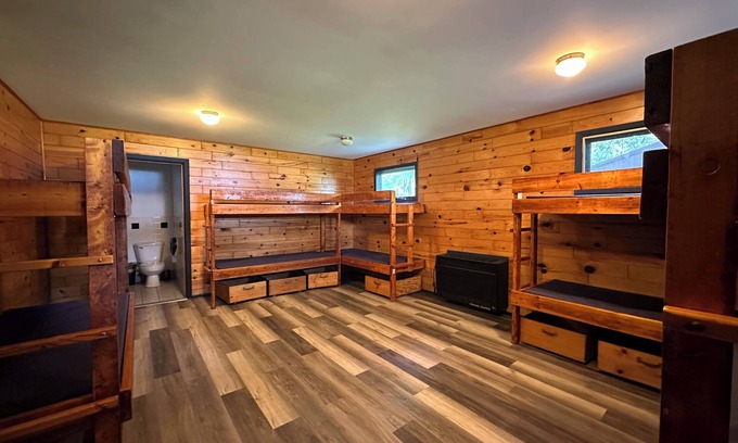 Pepin County Cabina | A summer camp cabin with attached bath and lounge area