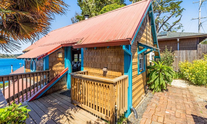 Old Town Cabaña | Adorable waterfront cottage with private hot tub, deck, & wood stove