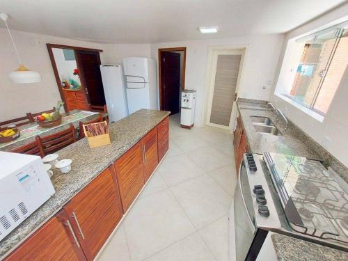 Jardim Virginia Casa | Alto padrão com piscina 300m da praia