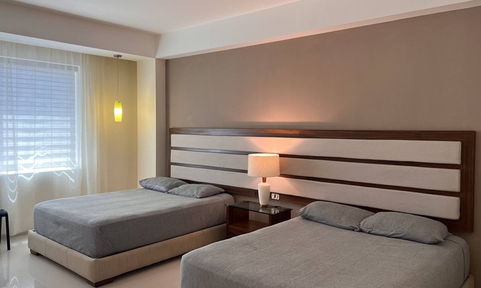 Alfredo V. Bonfil Apartamento | Amplia habitación doble a 5 minutos del aeropuerto