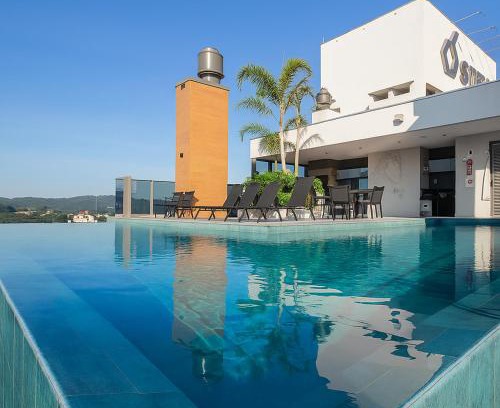 Centro Apartamento | Ap com Piscina no Rooftop, academia, Wi-Fi, cozinha completa, ar condicionado e garagem privativa a 900m da Vila Germânica