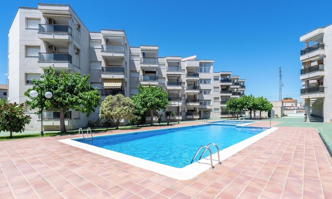 Creixell Apartamento | Apartamento 'Bumbai' con piscina compartida, jardín privado y aire acondicionado