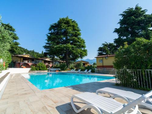 Villaggio Sanghen Casa | Apartment on Lake Garda with pebble beach pier for boat three swimming pools
