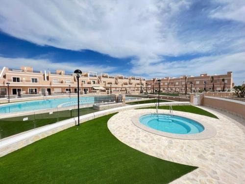 Pilar de la Horadada Apartamento | Apartment with private, heated jacuzzi, AC, pool