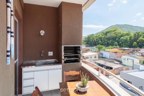 Estufa II Apartamento | Apto c/churrasq. próximo a orla Ubatuba-SP CDV042