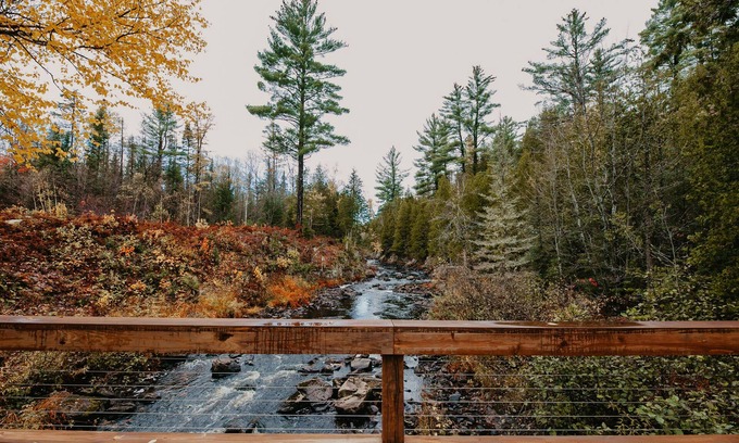 Champion Casa | ATV-Snowmobile Trail, Large home, sits on the peshekee river. sleeps 18 people.