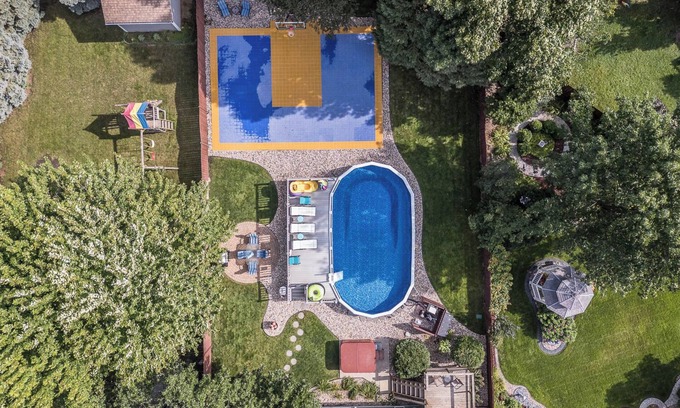 Sioux Falls Casa | Hot tub, game room, XL pool, garage, luxurious, while also family friendly.