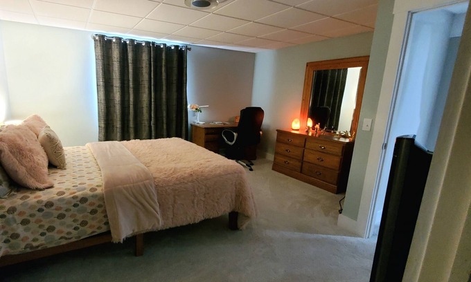 Williston North Condominio | Basement Space with bedroom, living room, movie theatre and gym.