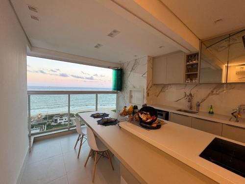 Itacolomi Apartamento | Beach club Pé na Areia