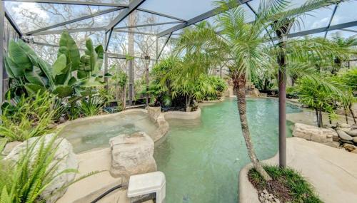 Marineland Acres Casa | Beach Home with Amazing Oasis Pool Spa Waterfall Fire Pit Bikes