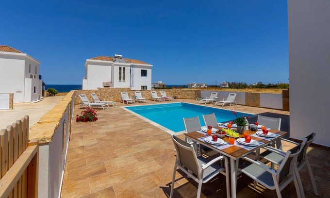 Pomos Villa | Beachfront 4 bed villa with sea views.