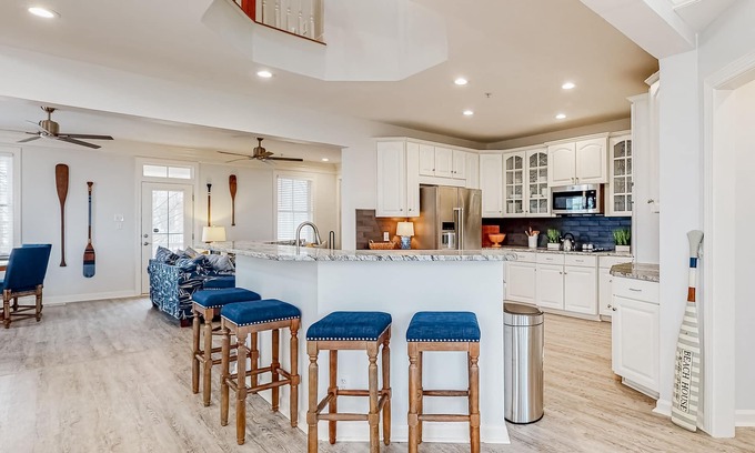 Sunset Island Casa | Beachside home with a gas fireplace, washer/dryer, pools, dock, & fitness room