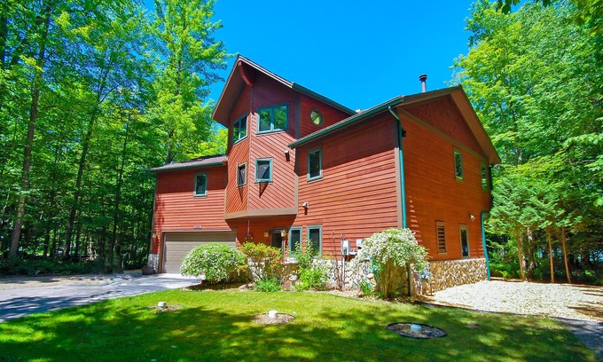 Empire Casa | Beautiful home on Little Glen Lake with a pool table, dock, fireplace, AC