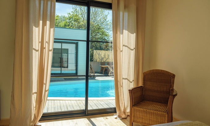 Plomeur Villa | Beautiful renovation of a farmhouse with modern extension, overlooking a swimming pool.