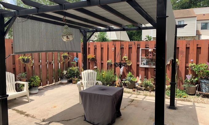 Ocala Casa | Beautiful unfurnished townhome that includes a patio with a pergola and fire pit