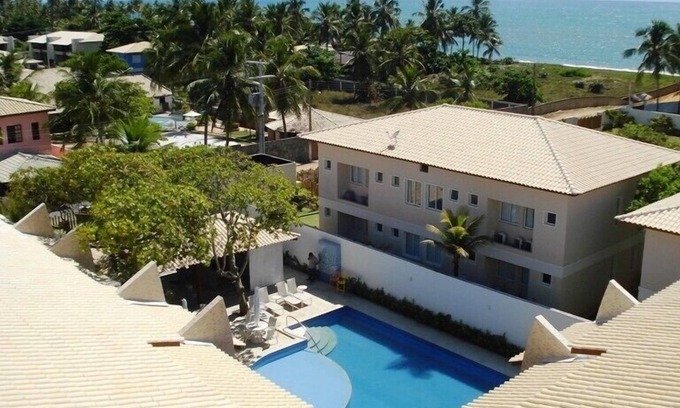 Itacimirim Apartamento | Hermoso pueblo, 4 dormitorios, 3 suites, 2 balcones, piscina, a 100 metros de la playa.