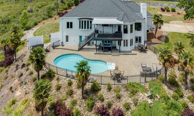 Rock Hill Casa | Beautiful Waterfront Home with abundant outdoor seating, pool, hot tub, grill