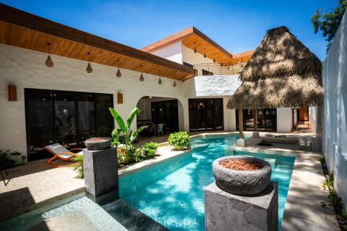 Potrero Casa | Bohemian Tropical Villa with a Tiki-Style Swimming Pool & Swim-Up Bar with an Attached Studio Apartment