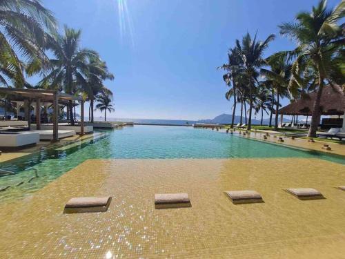 Olas Altas Apartamento | Bonito departamento pie de playa en el mejor condominio de manzanillo, Ponto Horizonte. Hermosa vista, hasta para 8 personas. Ambiente familiar.