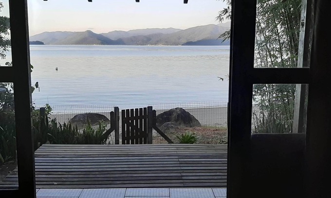 Florianopolis Casa | Delightful house on land with 5 beaches! Feet in the sand and peace!