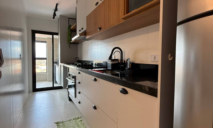 Praia Grande Apartamento | Brand new apartment right on the sand with sea view.