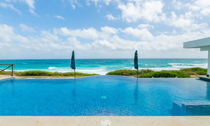 Isla Mujeres Villa | Brand New 12 Suite Villa directly on the waters edge of the Caribbean Sea