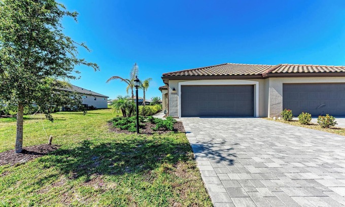 Lakewood Ranch Villa | BRAND NEW 2-bed/2-bath villa in Lorraine Lakes w/ expanded lanai. 3 beds w/ den!