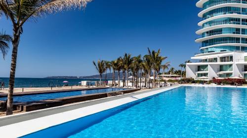 Flamingos Apartamento | Brand New Condo Aria Ocean 501 by Kivoya