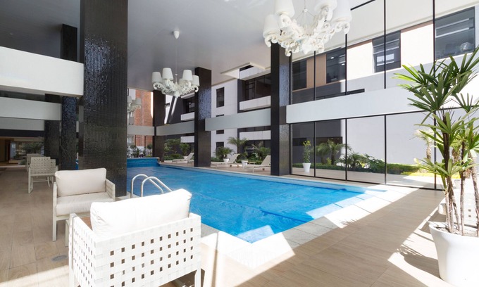 Distrito Financiero Apartamento | NUEVO Gran ubicación 1BDR 1. 5BTH WI-FI POOL GYM 24HR GUARD NETFLIX APARCAMIENTO