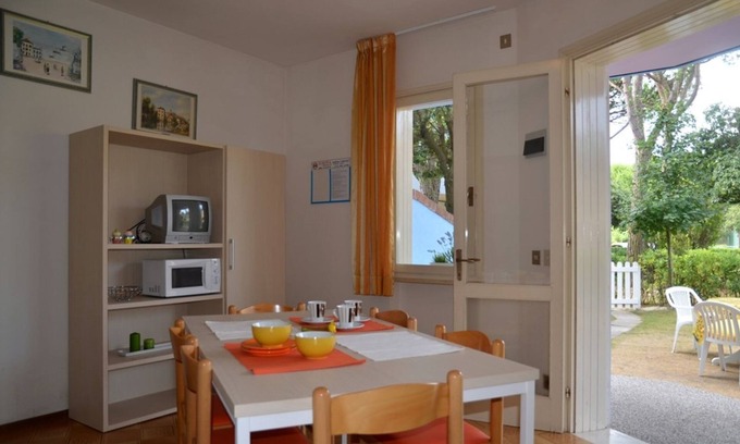 Bibione Apartamento | Apartamento luminoso y acogedor con jardín privado para disfrutar