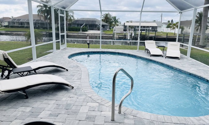 Gulf Cove Casa | Bright Waterfront Home. Heated Pool. Short drive to Beach. Beautiful Sunsets.
