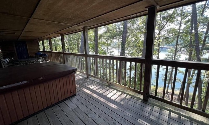Mount Ida Cabaña | C16, Two bedroom, two bath, log-sided Harbor North luxury cottage with hot tub overlooking Lake Ouachita. by RedAwning