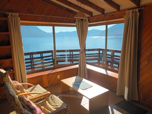Caburgua Apartamento | Cabaña Celeste - Acceso directo a playa lago Caburgua y cancha de tenis - direct access Beach in Caburgua Lake and tenis court