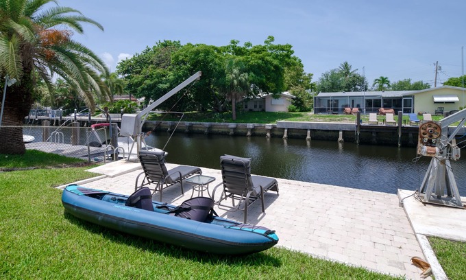 Cypress Lakes Casa | Canal-front home with pool, dock, patio, grill, sundeck, AC & washer/dryer