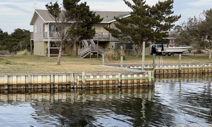 Frisco Casa | Canal Front Home with a Dock and Hot Tub minutes from the beach!