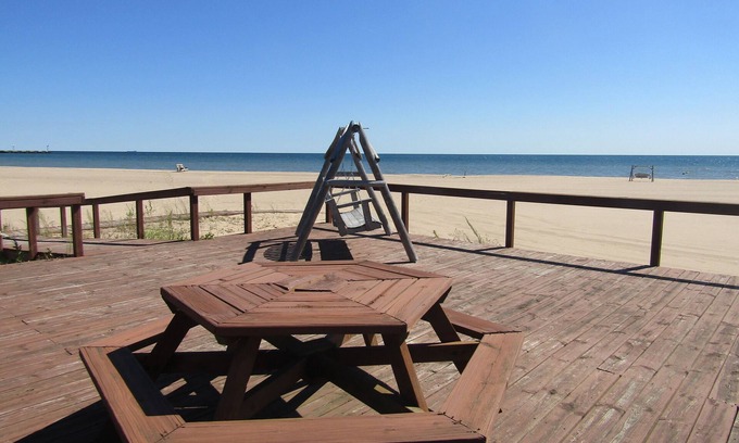 Au Sable Condominio | Carpe Diem 365 located on Lake Huron sandy beach!