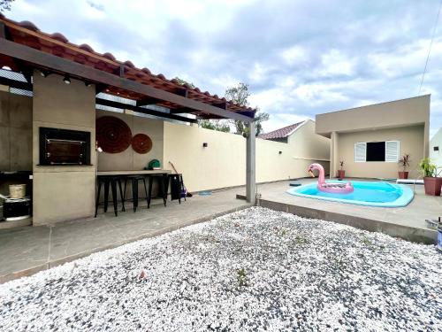 Guaratuba Casa | Casa com piscina , ar condicionado e churrasqueira no balneário Eliana