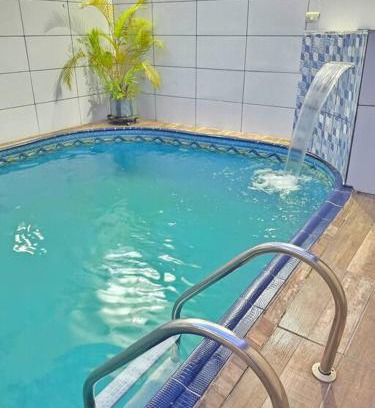 Maracana Casa | Casa com Piscina Cascata Na Praia Grande