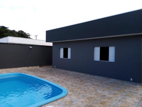 Peruibe Casa | Casa com piscina em condomínio fechado