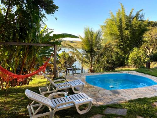 Ijaci Casa | Casa com piscina fundo pra represa e AR Condicionado CasinhaBrancaDeVaranda
