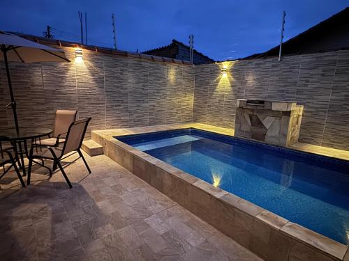 Mongagua Casa | Casa com piscina garagem para 4 carros