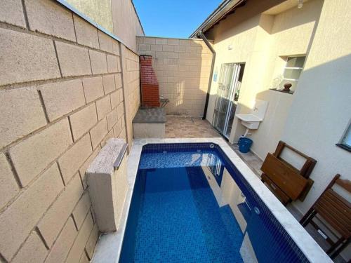 Tupy Casa | Casa em condomínio piscina privativa churrasqueira