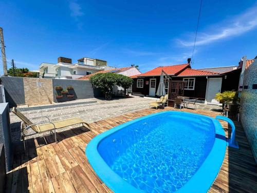 Ze Amandio Casa | CASA FOCA 271 - casa aconchegante com piscina, churrasqueira, mesa de sinuca e pebolim