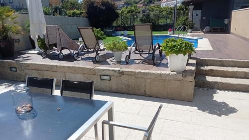 Combarro Casa | Casa piscina boleros