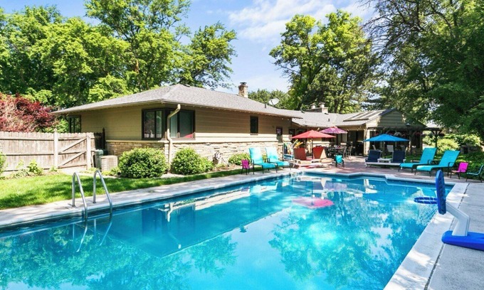 West Omaha Casa | Central Omaha Pool w/ Spa Oasis + Fire Pit + 3 Living Rooms