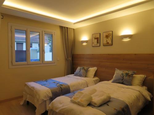 Bondy Casa | Chambre deux lits séparés
