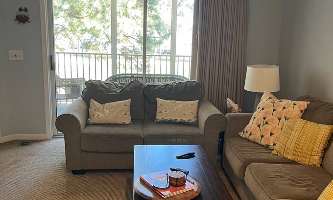 Sea Trail Condominio | Charming 2-bedroom condo with Wi-Fi in tranquil Sunset Beach on Golf Course.